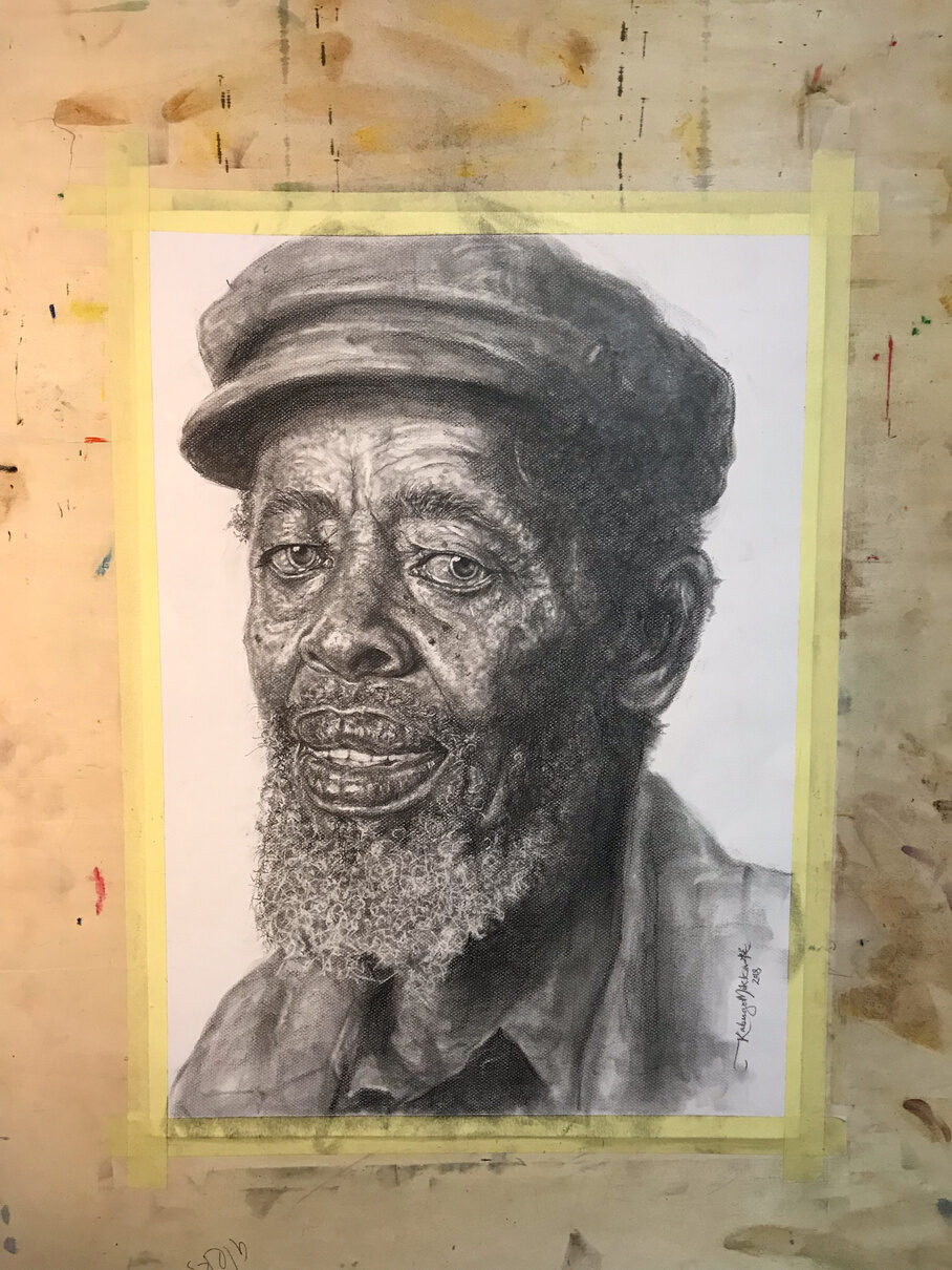 Process, stage four: the finished portrait on the board, with the textured beard and cap fully rendered.