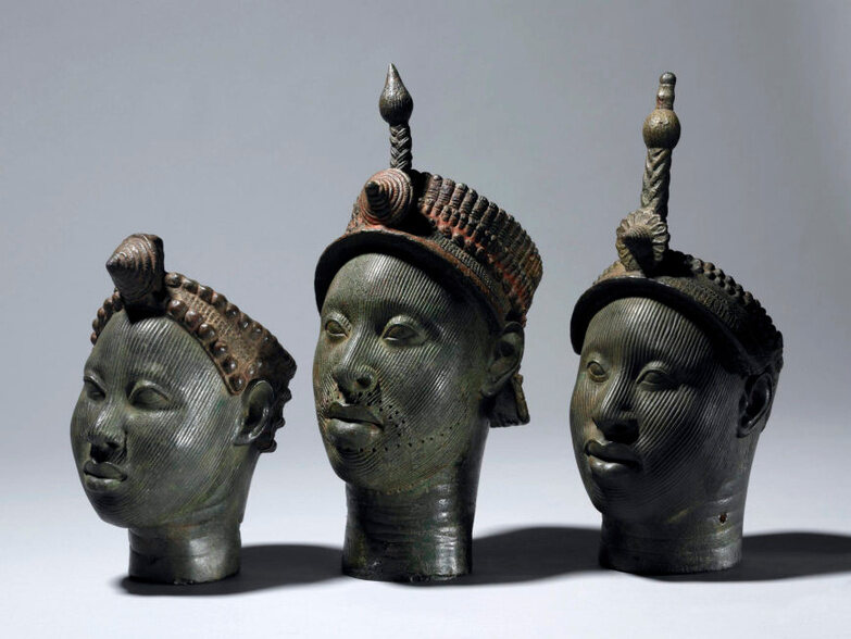 Three crowned Ife heads in a row.